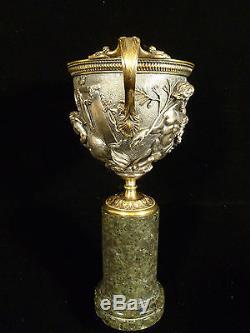 19th CENTURY SILVER PLATED BRONZE MYTHOLOGICAL RELIEF VASE ON MARBLE PEDESTAL