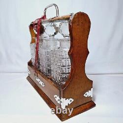 ANTIQUE 3 BOTTLE ENGLISH OAK & SILVER PLATE DRINKS TANTALUS (Circa 1880's)
