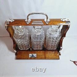 ANTIQUE 3 BOTTLE ENGLISH OAK & SILVER PLATE DRINKS TANTALUS (Circa 1880's)