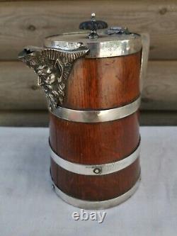 A Fine Victorian Oak and Silver Plated Ewer