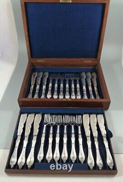 A Victorian twelve place canteen of silver plate fish knives and forks