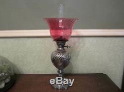 An old Walker & Hall silver plated oil lamp