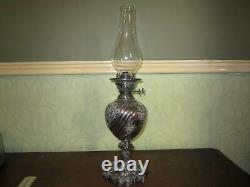 An old Walker & Hall silver plated oil lamp