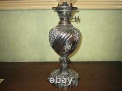 An old Walker & Hall silver plated oil lamp