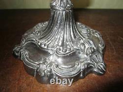 An old Walker & Hall silver plated oil lamp