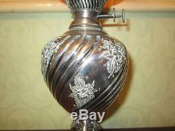 An old Walker & Hall silver plated oil lamp