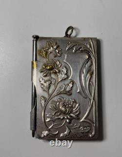 Antique Art Nouveau silver-plated metal dance card with floral motifs