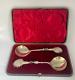 Antique c1907 Pair Ornate Gold Plated Serving Spoons as Palms Dark Metal Climber