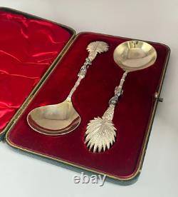Antique c1907 Pair Ornate Gold Plated Serving Spoons as Palms Dark Metal Climber