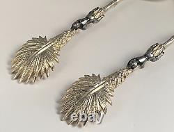 Antique c1907 Pair Ornate Gold Plated Serving Spoons as Palms Dark Metal Climber