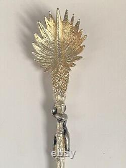 Antique c1907 Pair Ornate Gold Plated Serving Spoons as Palms Dark Metal Climber