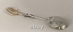 Antique c1907 Pair Ornate Gold Plated Serving Spoons as Palms Dark Metal Climber