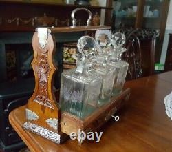 Antique carved oak, engraved 3 bottle Tantulas silver plated mounts and key