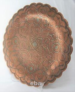 Antique copper silver plate in Islamic Persian style with floral patterning