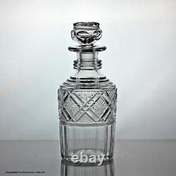 Early Victorian set of three cut glass cylinder decanters, silver plated stand