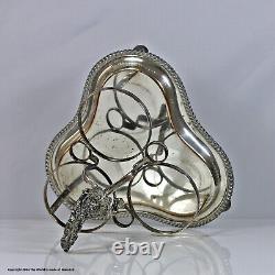Early Victorian set of three cut glass cylinder decanters, silver plated stand