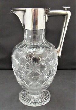 English cut glass claret jug, c1900 with silver plated mount and push button lid