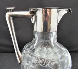 English cut glass claret jug, c1900 with silver plated mount and push button lid