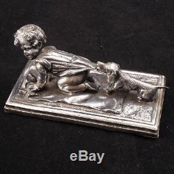 German silver plate paperweight of a child being pulled by a Dachshund Ca 1880