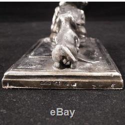 German silver plate paperweight of a child being pulled by a Dachshund Ca 1880
