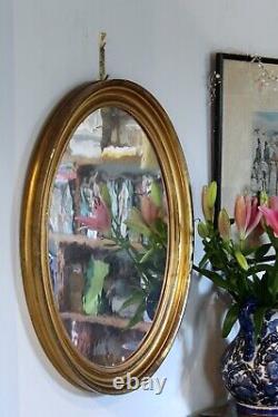 Pair of Antique Gilt Oval Mirrors with Silver Verre Eglomise glass plates