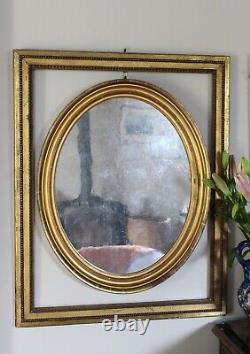 Pair of Antique Gilt Oval Mirrors with Silver Verre Eglomise glass plates