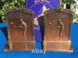 Vintage silver-plated football bookends, leather helmets, circa 1920s